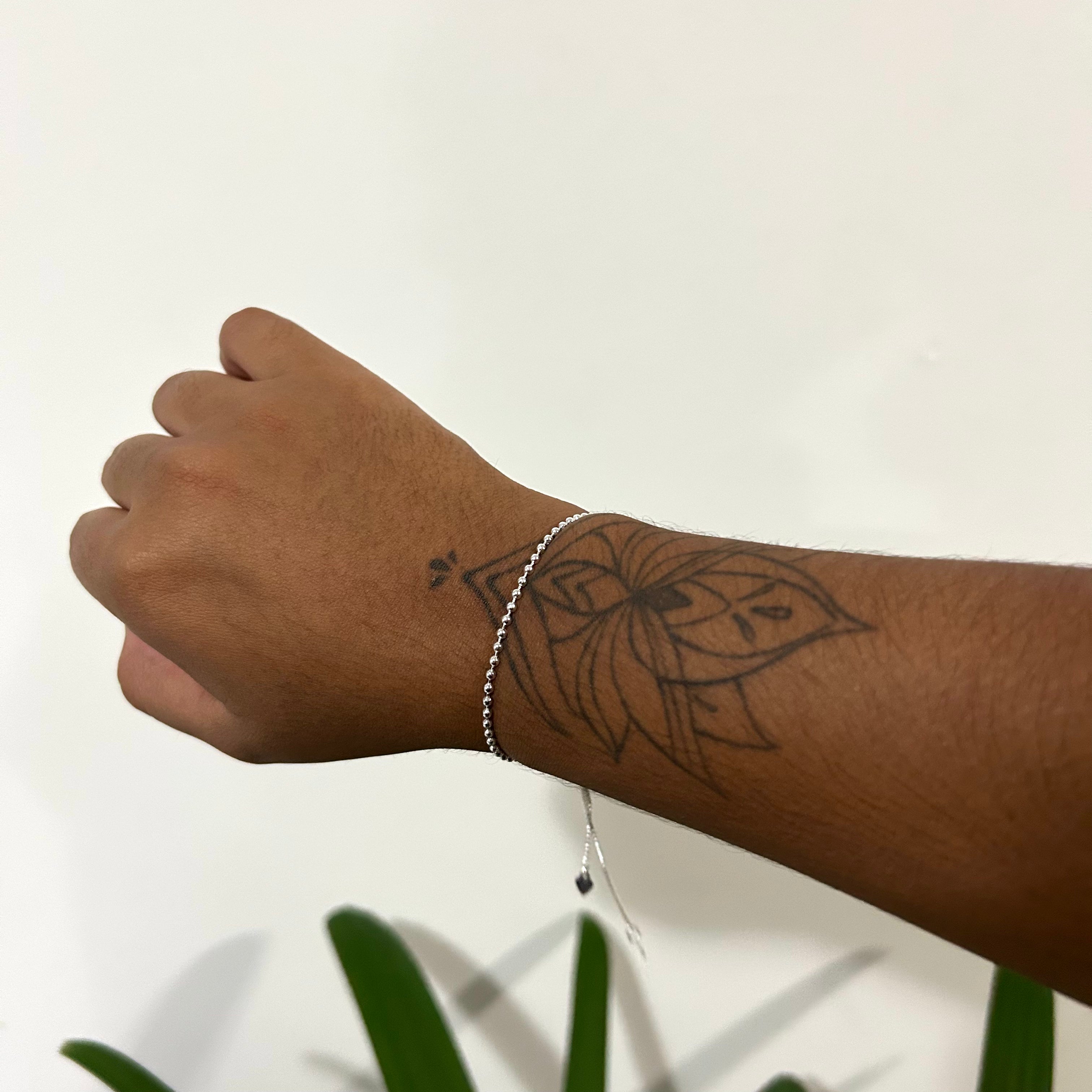 Pulseira bolinhas com limitador banhada em prata 925